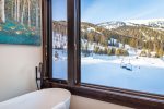 Relax in the oversized soaker tub in the master bathroom & take in view of Whitefish Mountain Resort.